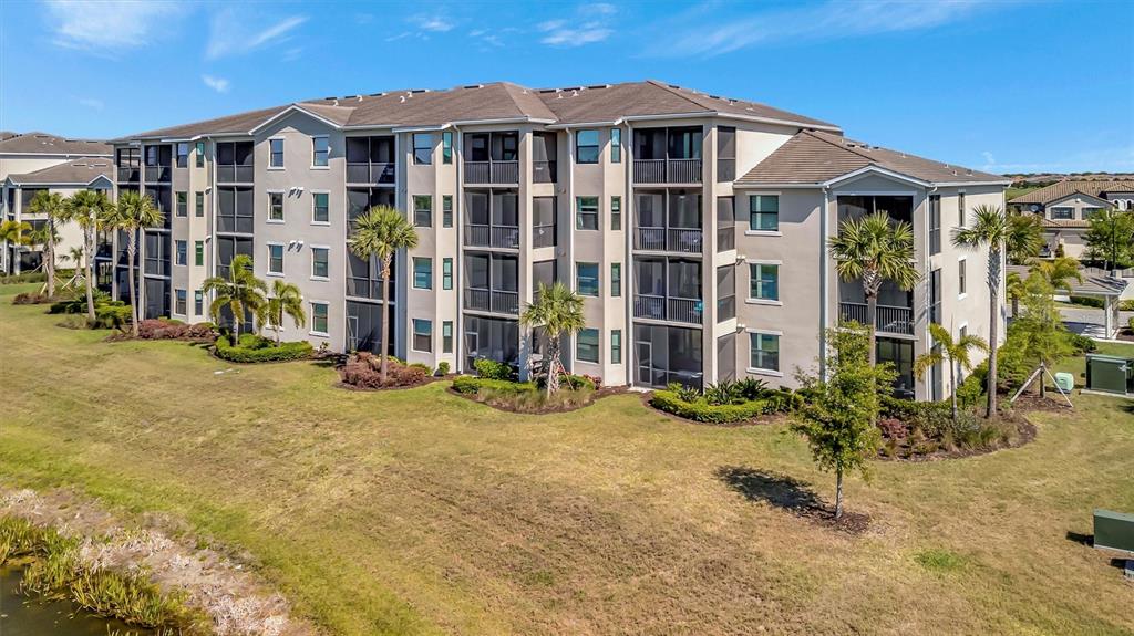 17724 Gawthrop Drive, Unit 101 Bradenton, FL 34211 - Photo 2 of 28 a view of a big house with many windows