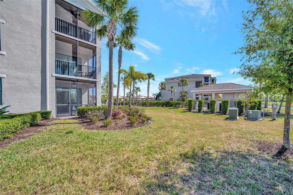 17724 Gawthrop Drive, Unit 101 Bradenton, FL 34211 - Photo 27 of 28 a front view of a house with yard and trees