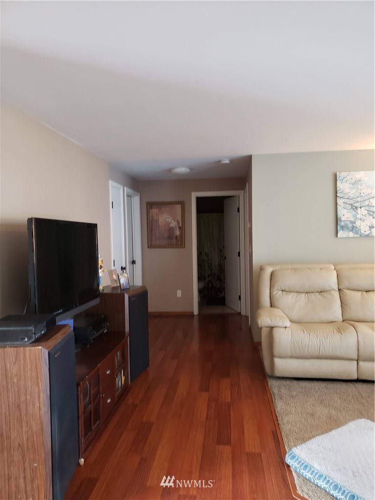 18301 Brandywine Court Southwest Rochester, WA 98579 - Photo 12 of 25 a living room with furniture and flat screen tv