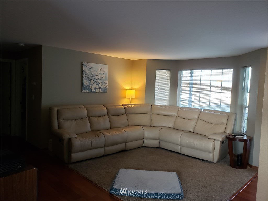 18301 Brandywine Court Southwest Rochester, WA 98579 - Photo 13 of 25 a living room with furniture rug and window