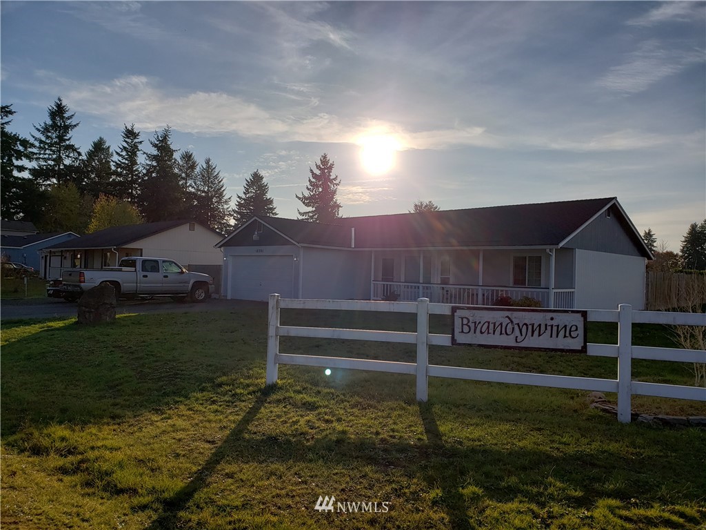 18301 Brandywine Court Southwest Rochester, WA 98579 - Photo 3 of 25 a view of a house with a yard