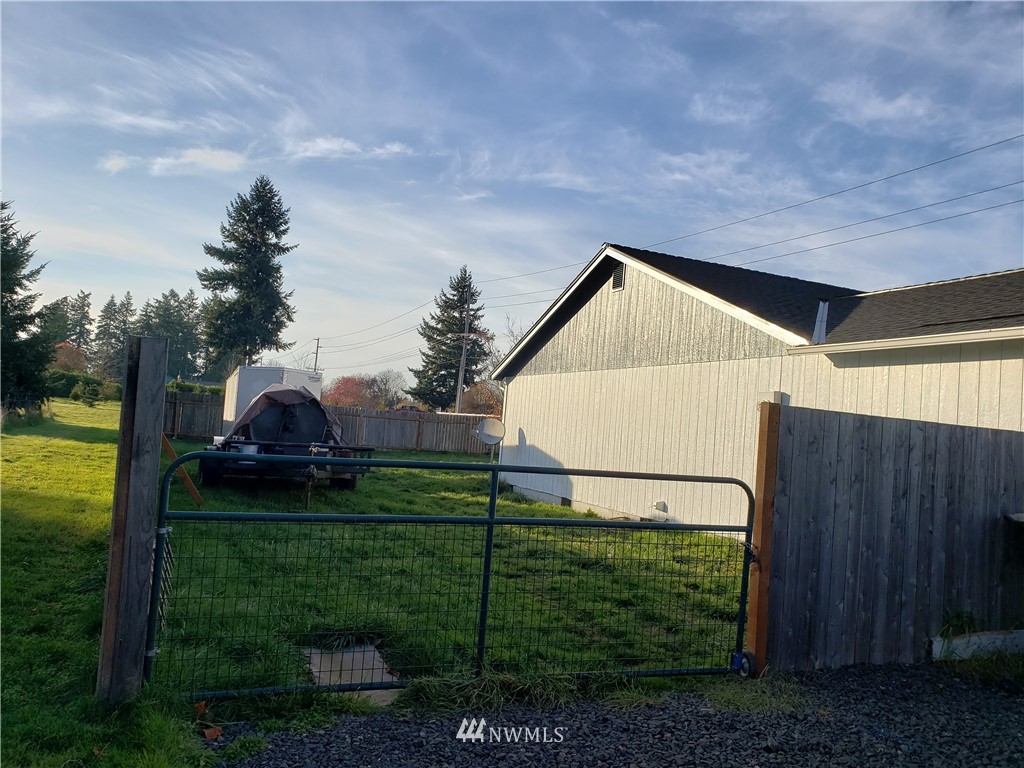 18301 Brandywine Court Southwest Rochester, WA 98579 - Photo 5 of 25 a front view of a house with garden