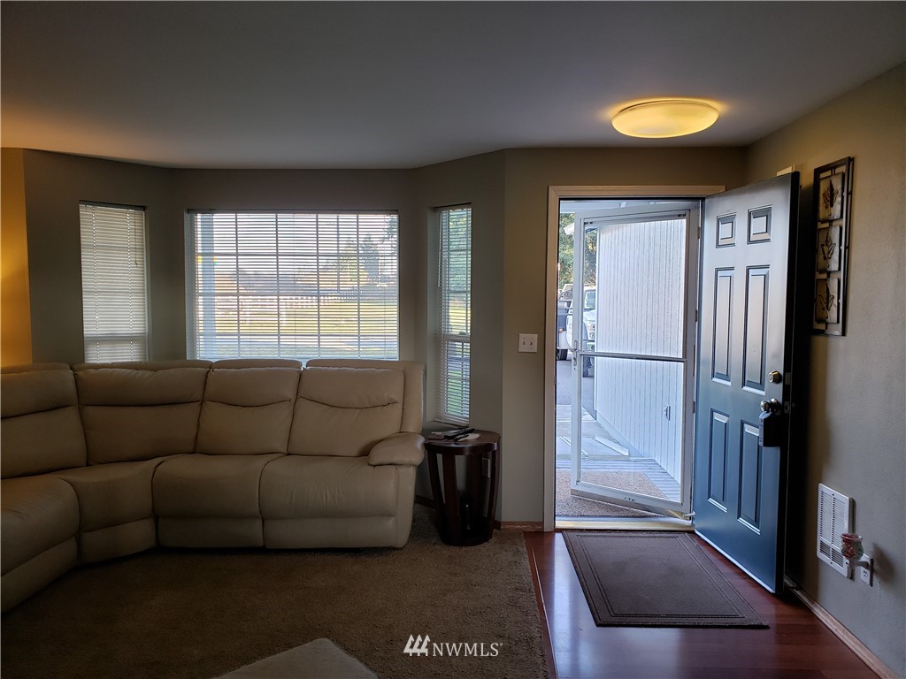 18301 Brandywine Court Southwest Rochester, WA 98579 - Photo 6 of 25 a living room with furniture and a window