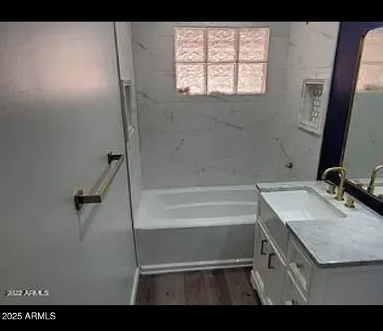 a bathroom with a sink and a mirror