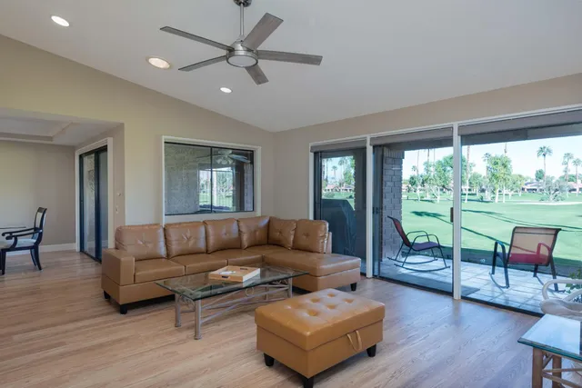 a view of a golf course with a houses