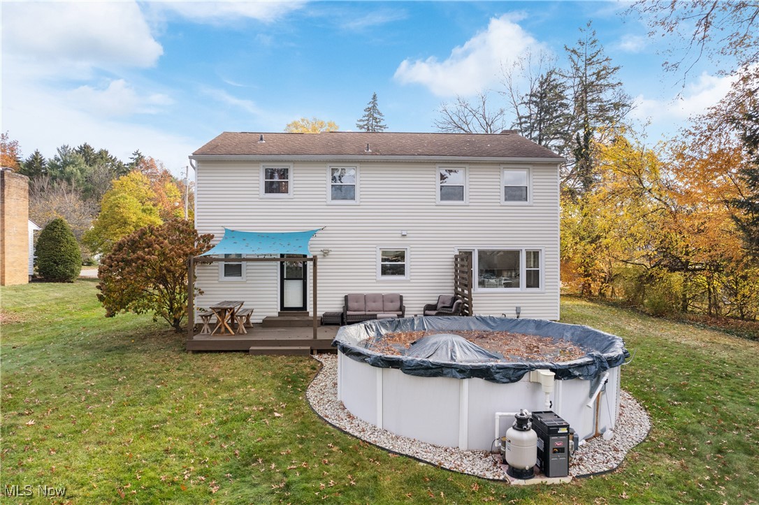1436 Rumbaugh Circle Wooster, OH 44691 - Photo 25 of 30 Back of property featuring a yard and a pool side deck