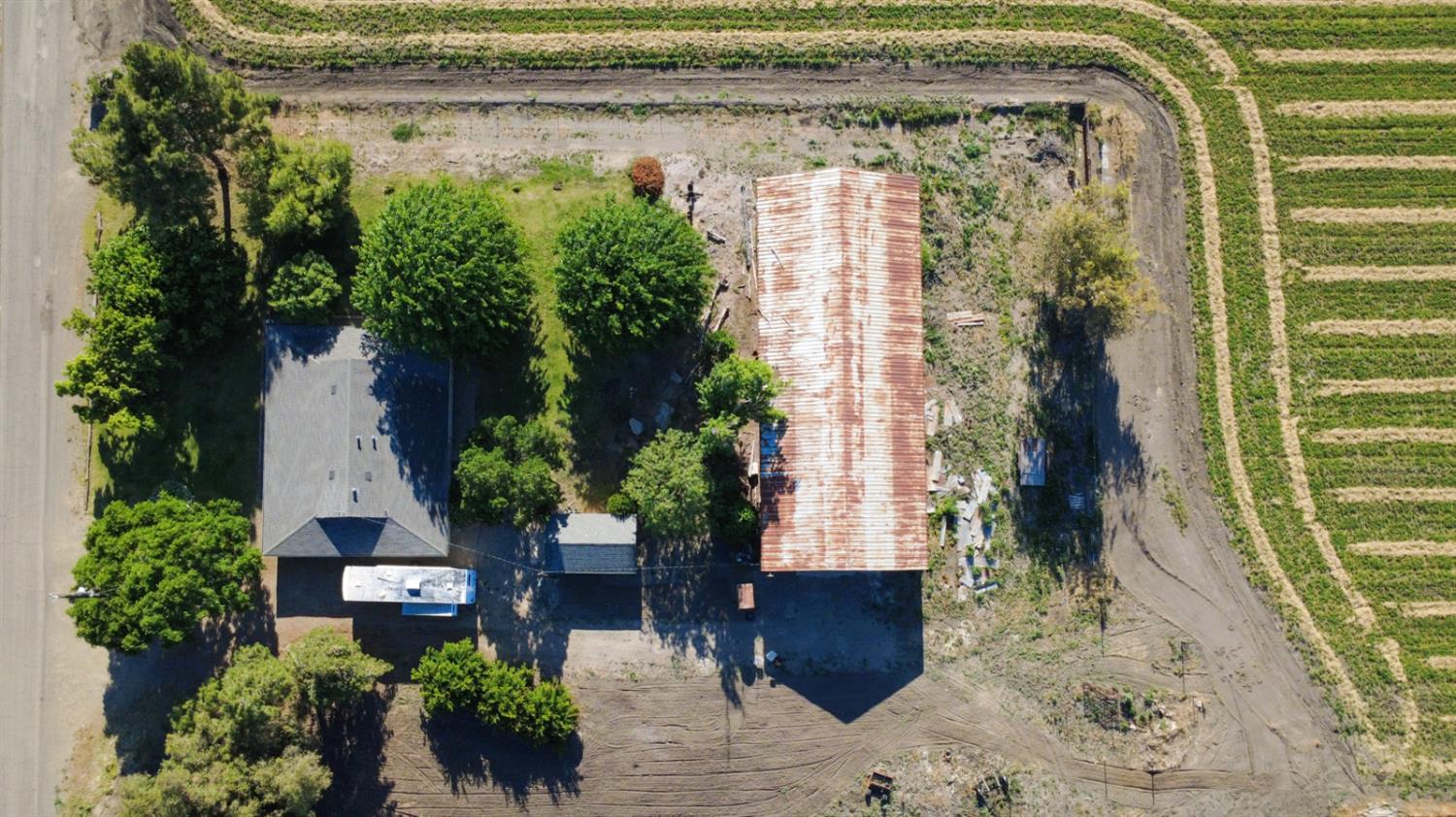 44671 Hobart Road Dos Palos, CA 93620 - Photo 34 of 43 Property with main residence and a long outbuilding 'The Shop'