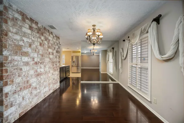 a view of entryway with wooden floor