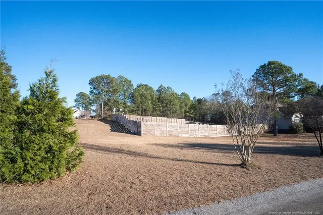 a view of a yard with an trees