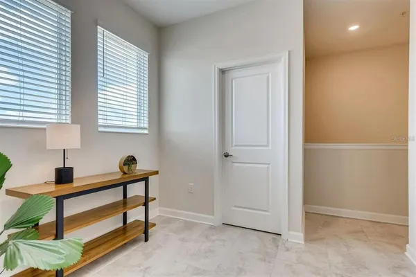 a room that has a window and a dresser in it
