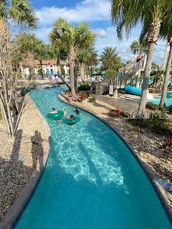 545 Ocean Course Avenue, Unit 545 Davenport, FL 33896 - Photo 31 of 32 a view of a backyard with a garden