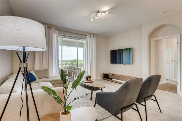 a view of a livingroom with furniture and a table