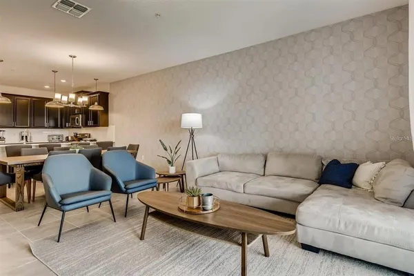 a living room with furniture and a table
