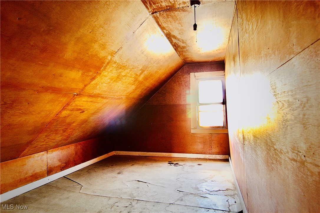 12406 Kinsman Road Cleveland, OH 44120 - Photo 13 of 29 Additional living space with vaulted ceiling and baseboards