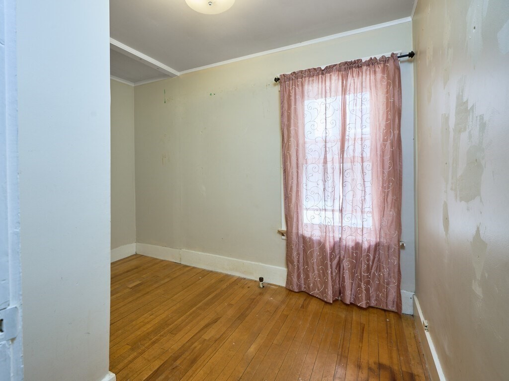 88 Beaconsfield Road Worcester, MA 01602 - Photo 21 of 34 a view of a room with wooden floor and a window