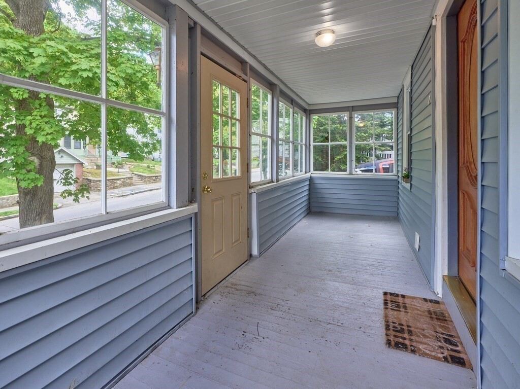 88 Beaconsfield Road Worcester, MA 01602 - Photo 3 of 34 a view of an empty room with wooden floor and a window