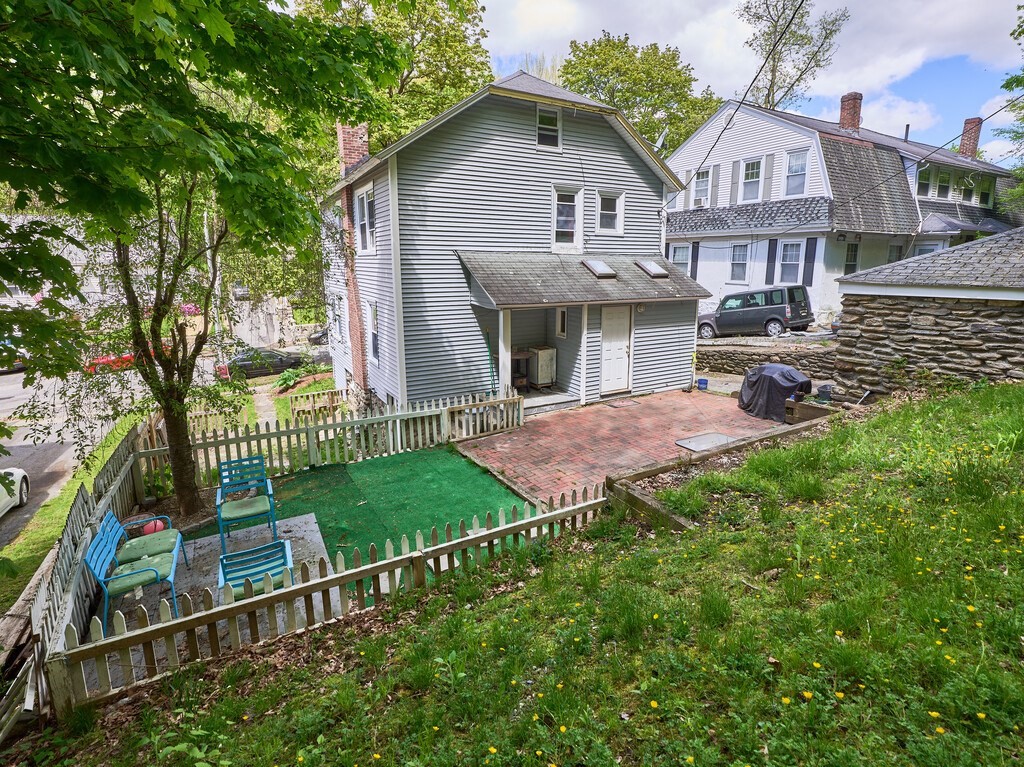 88 Beaconsfield Road Worcester, MA 01602 - Photo 32 of 34 a view of a house with a yard and sitting area