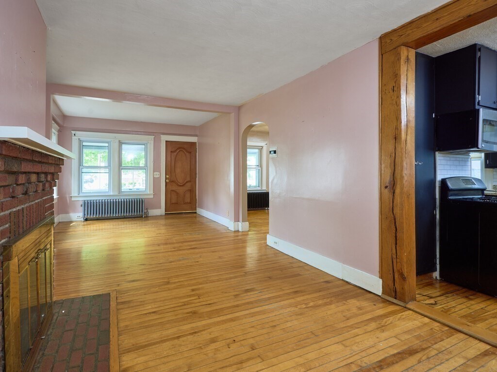 88 Beaconsfield Road Worcester, MA 01602 - Photo 6 of 34 a view of empty room with a fireplace