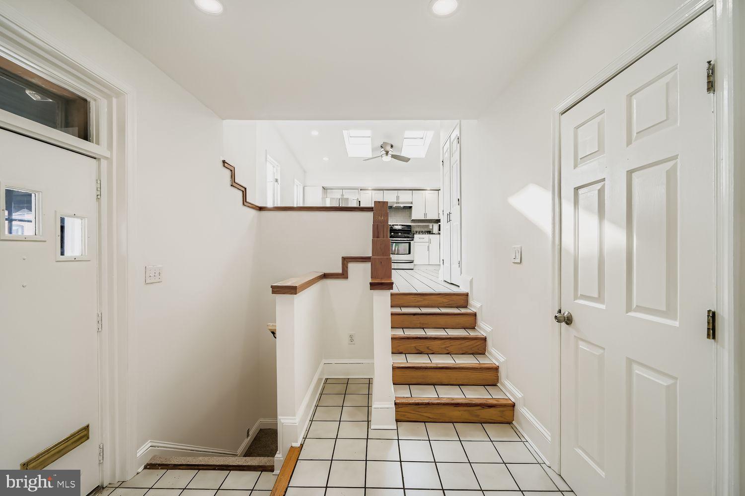 3143 Dillon Street Baltimore, MD 21224 - Photo 23 of 26 Bright entryway with inviting staircase.