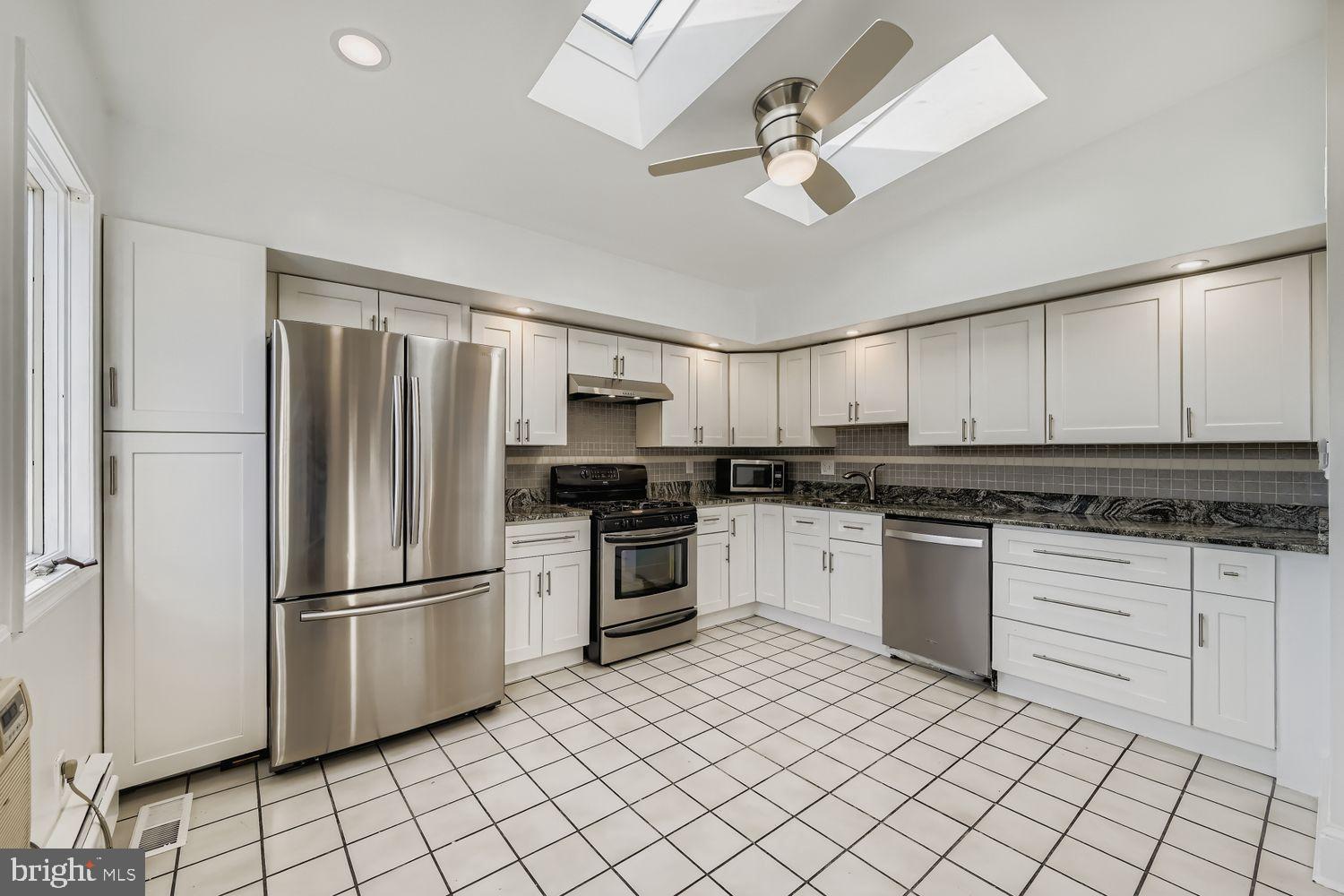 3143 Dillon Street Baltimore, MD 21224 - Photo 8 of 26 Bright and airy modern kitchen design.