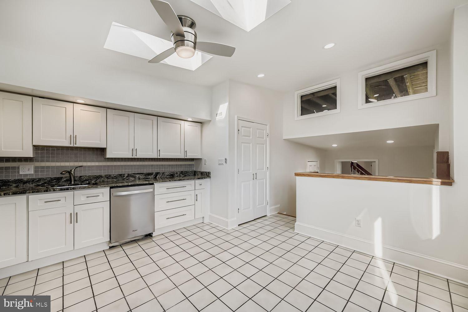 3143 Dillon Street Baltimore, MD 21224 - Photo 10 of 26 Bright, modern kitchen with sleek finishes.