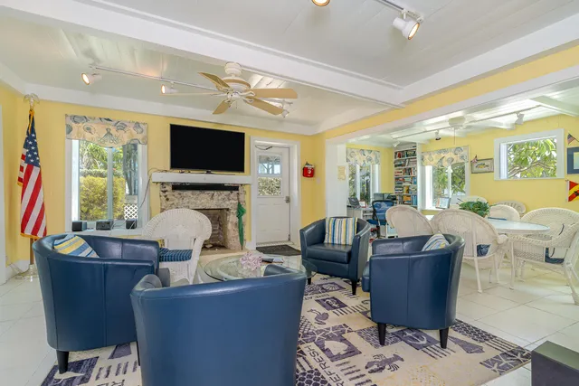 a kitchen with stainless steel appliances kitchen island granite countertop a refrigerator and cabinets