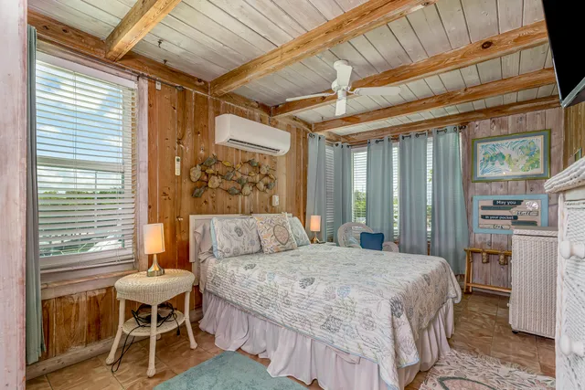 a kitchen with a sink and a wooden floor