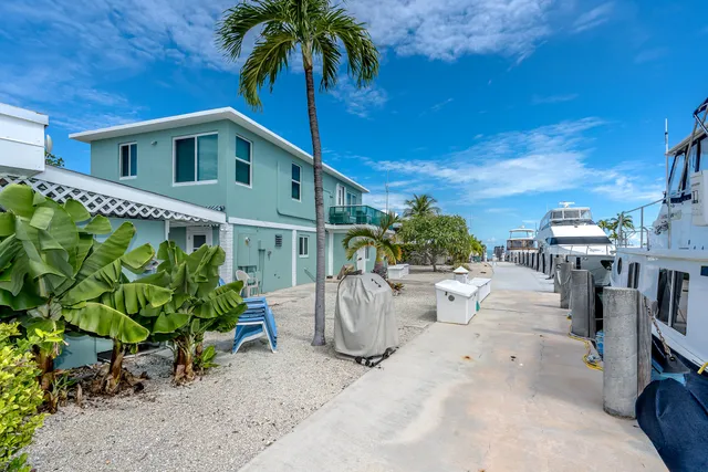 a view of a chair and tables in patio