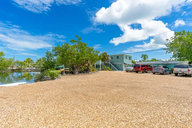 a view of a backyard with chair and table