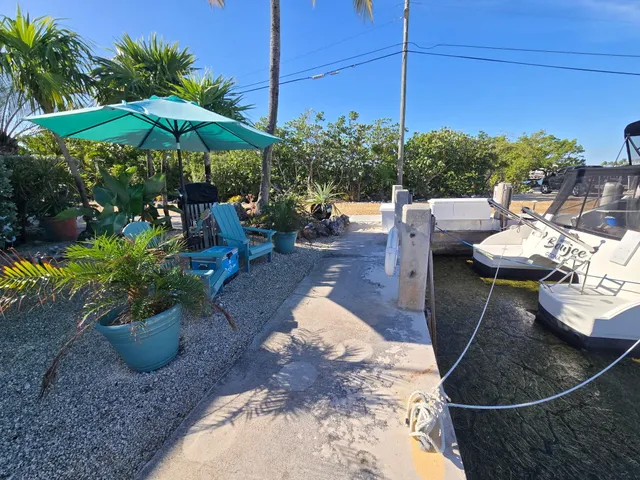 a view of a backyard with sitting area and furniture