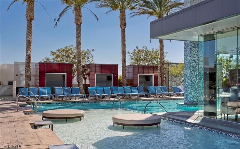 4381 West Flamingo Road, Unit 15310 Las Vegas, NV 89103 - Photo 35 of 52 View of swimming pool featuring a patio and outdoor lounge area