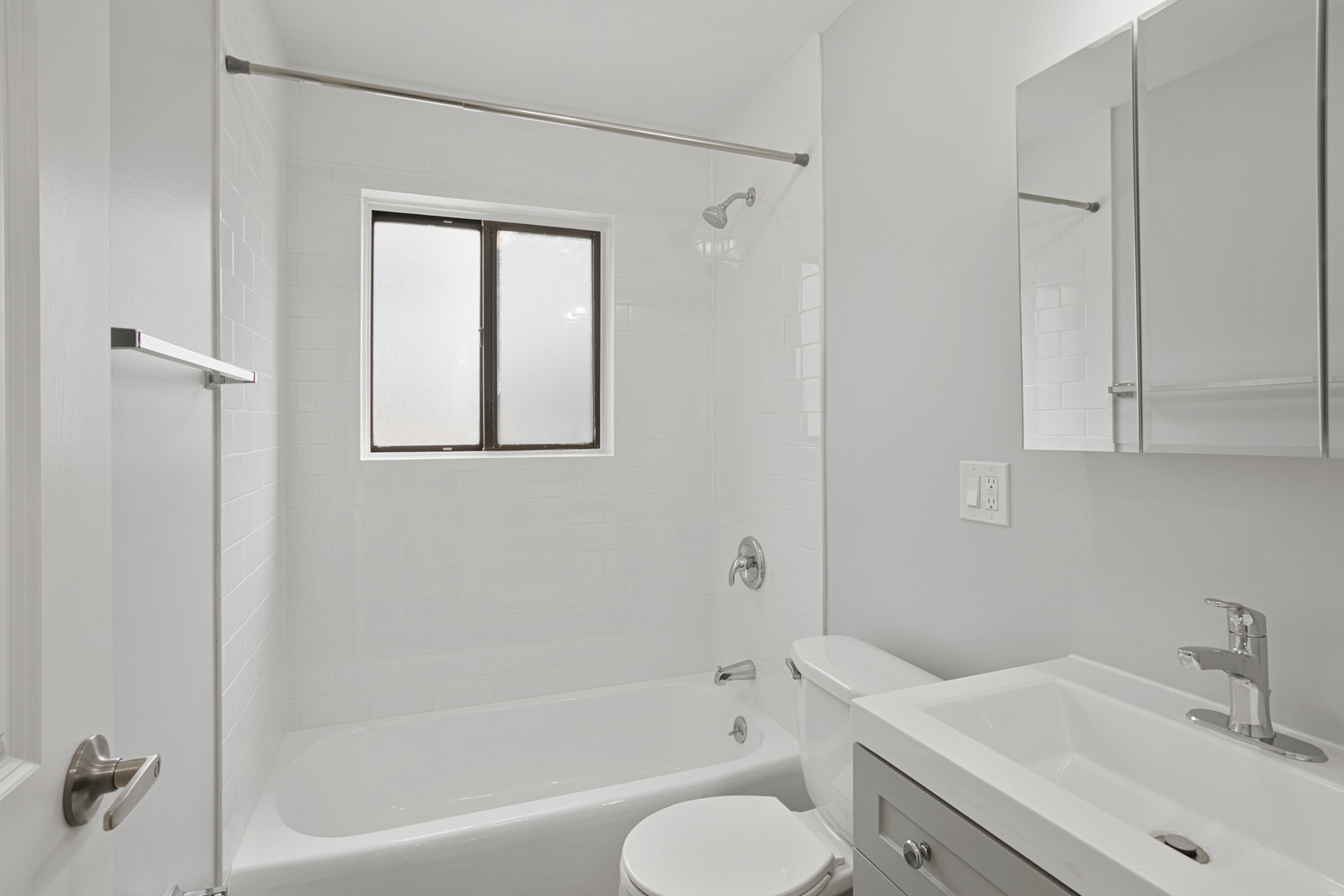 6826 North Ridge Boulevard, Unit 305 Chicago, IL 60645 - Photo 10 of 13 a bathroom with a sink toilet and shower