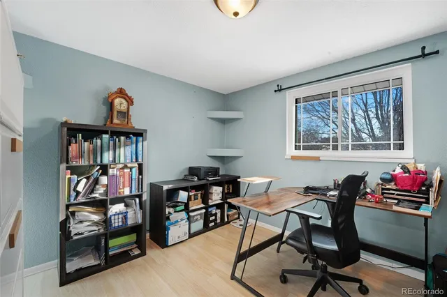 a walk in closet with a couch