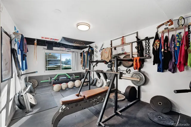 a bathroom with a sink and mirror with bathtub
