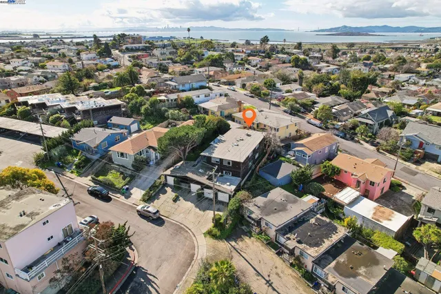 an aerial view of a house with a yard