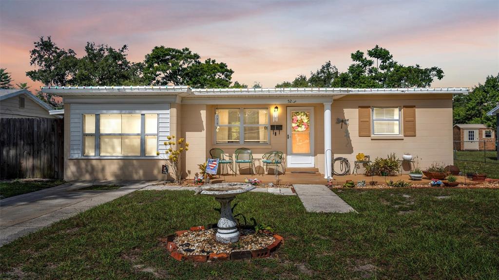 523 Hampton Avenue Lakeland, FL 33801 - Photo 1 of 36 a front view of a house with garden
