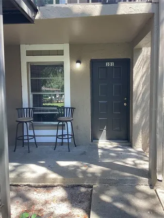 a view of a livingroom with furniture and front door