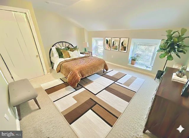 a bathroom with a black and white checkered floor