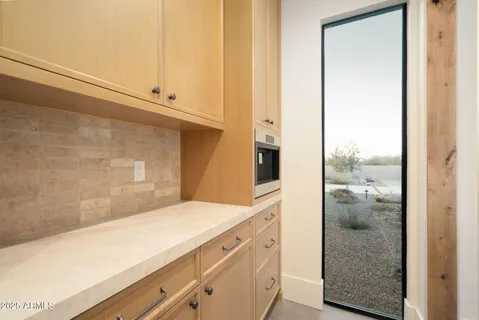 a view of kitchen and utility room