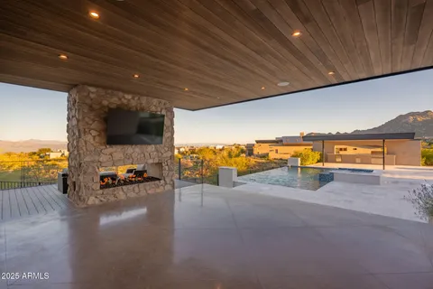 a view of a swimming pool with an outdoor seating