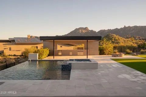 swimming pool view with a lake view