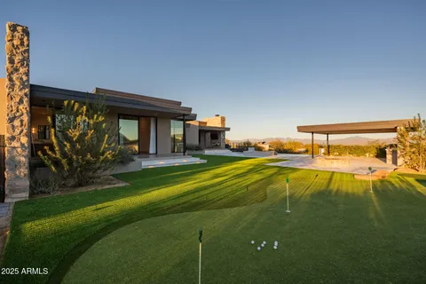 a swimming pool view with a outdoor seating