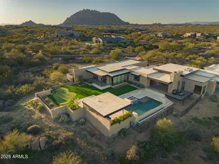 an aerial view of a house with a garden