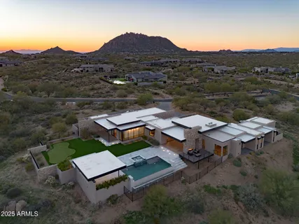 an aerial view of a house with mountain view