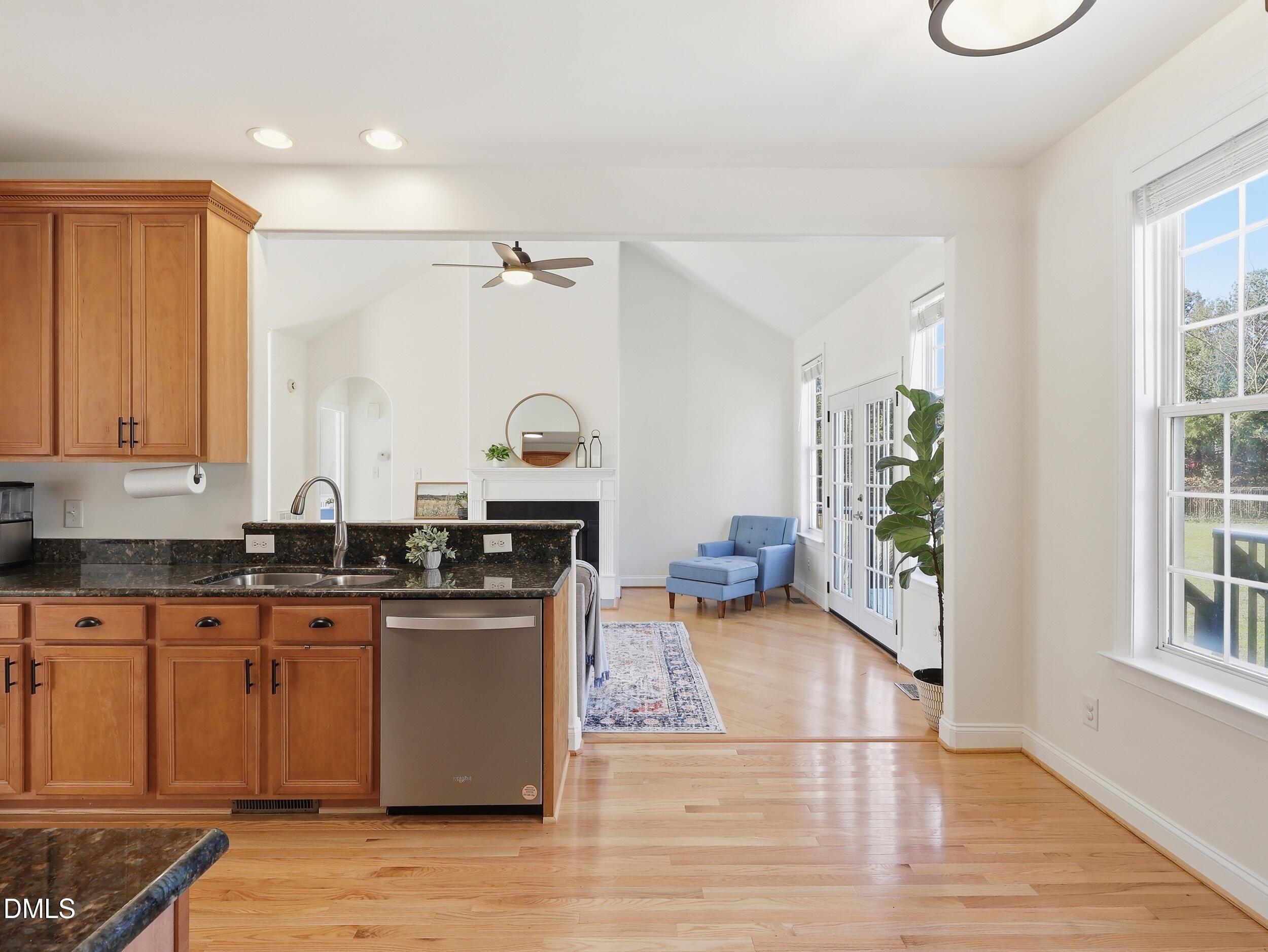 10 Kinderkamack Road Youngsville, NC 27596 - Photo 11 of 46 a kitchen with stainless steel appliances granite countertop a stove a sink dishwasher and cabinets with wooden floor