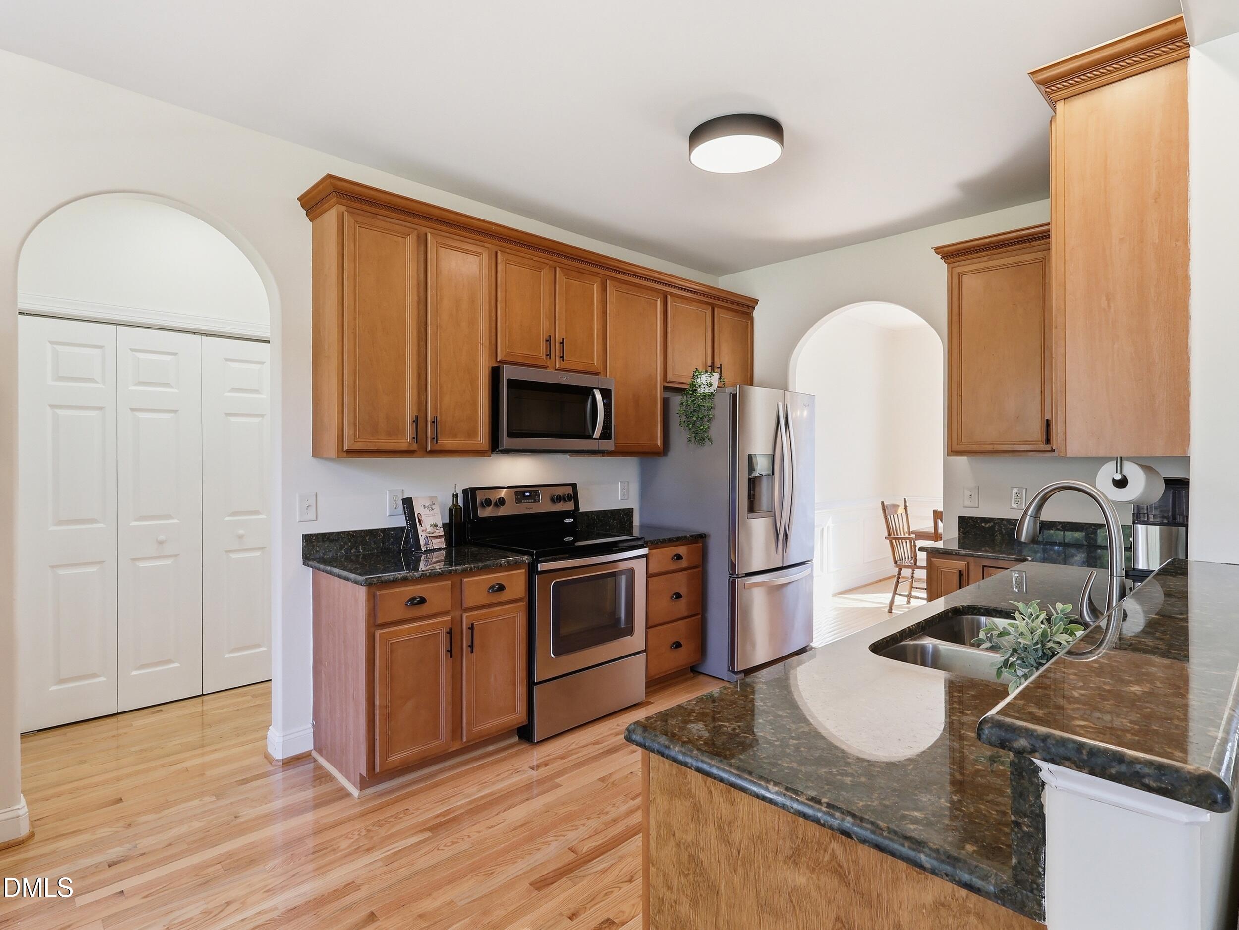 10 Kinderkamack Road Youngsville, NC 27596 - Photo 12 of 46 a kitchen with a sink stove and refrigerator