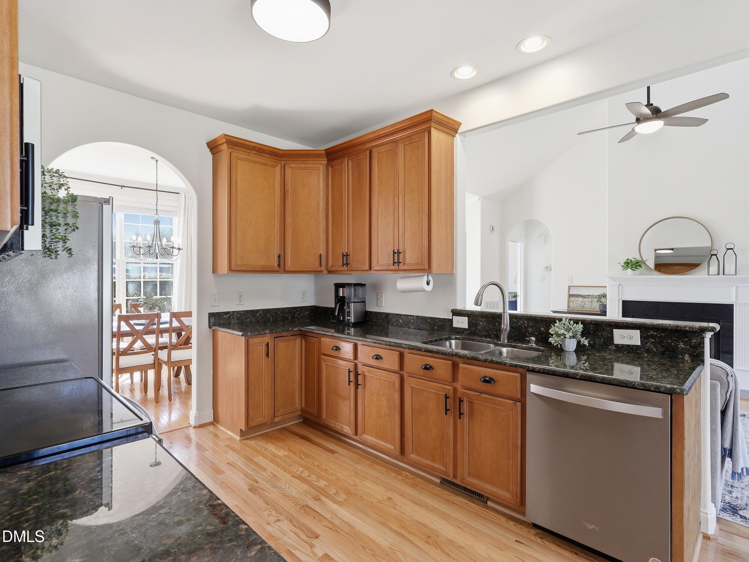 10 Kinderkamack Road Youngsville, NC 27596 - Photo 13 of 46 a kitchen with stainless steel appliances granite countertop a stove a sink and a refrigerator
