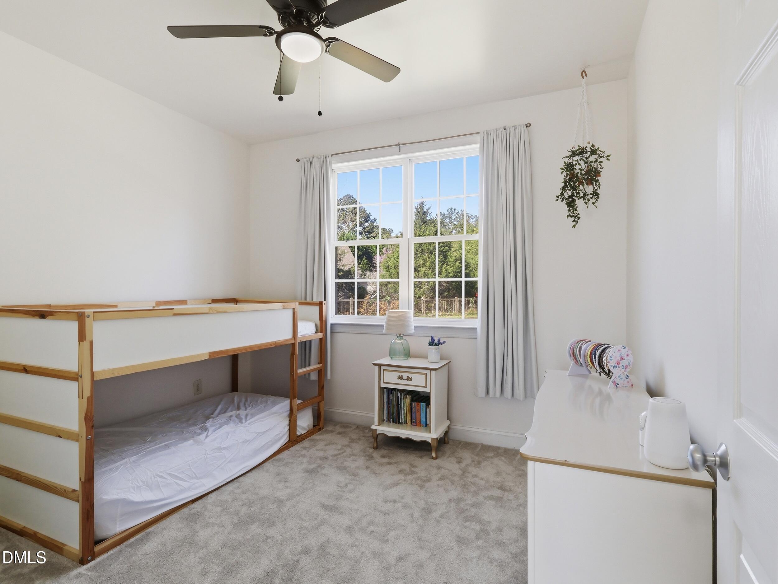 10 Kinderkamack Road Youngsville, NC 27596 - Photo 21 of 46 a view of a room with baby crib and furniture