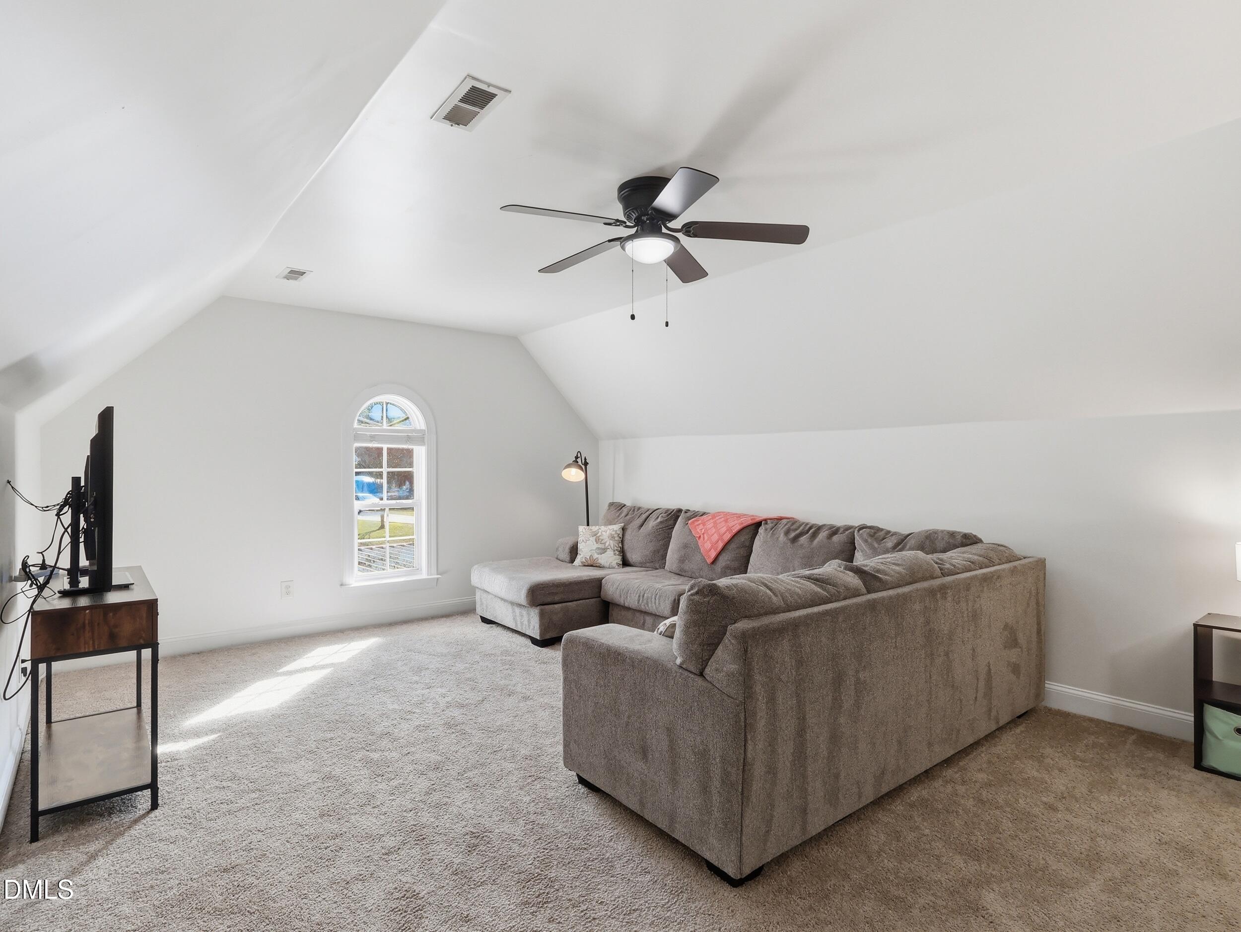 10 Kinderkamack Road Youngsville, NC 27596 - Photo 23 of 46 a living room with furniture and a window