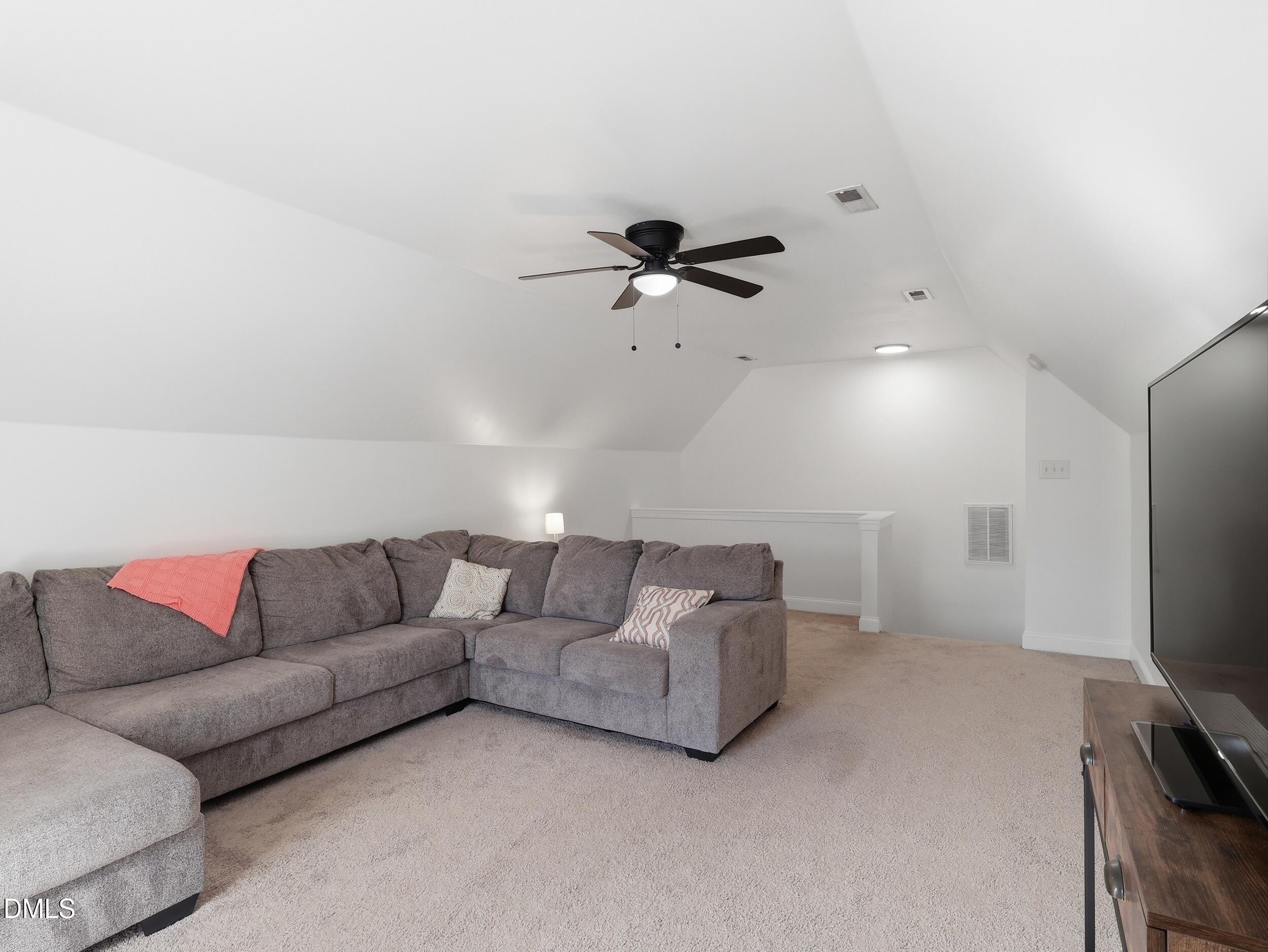 10 Kinderkamack Road Youngsville, NC 27596 - Photo 24 of 46 a living room with furniture and a flat screen tv